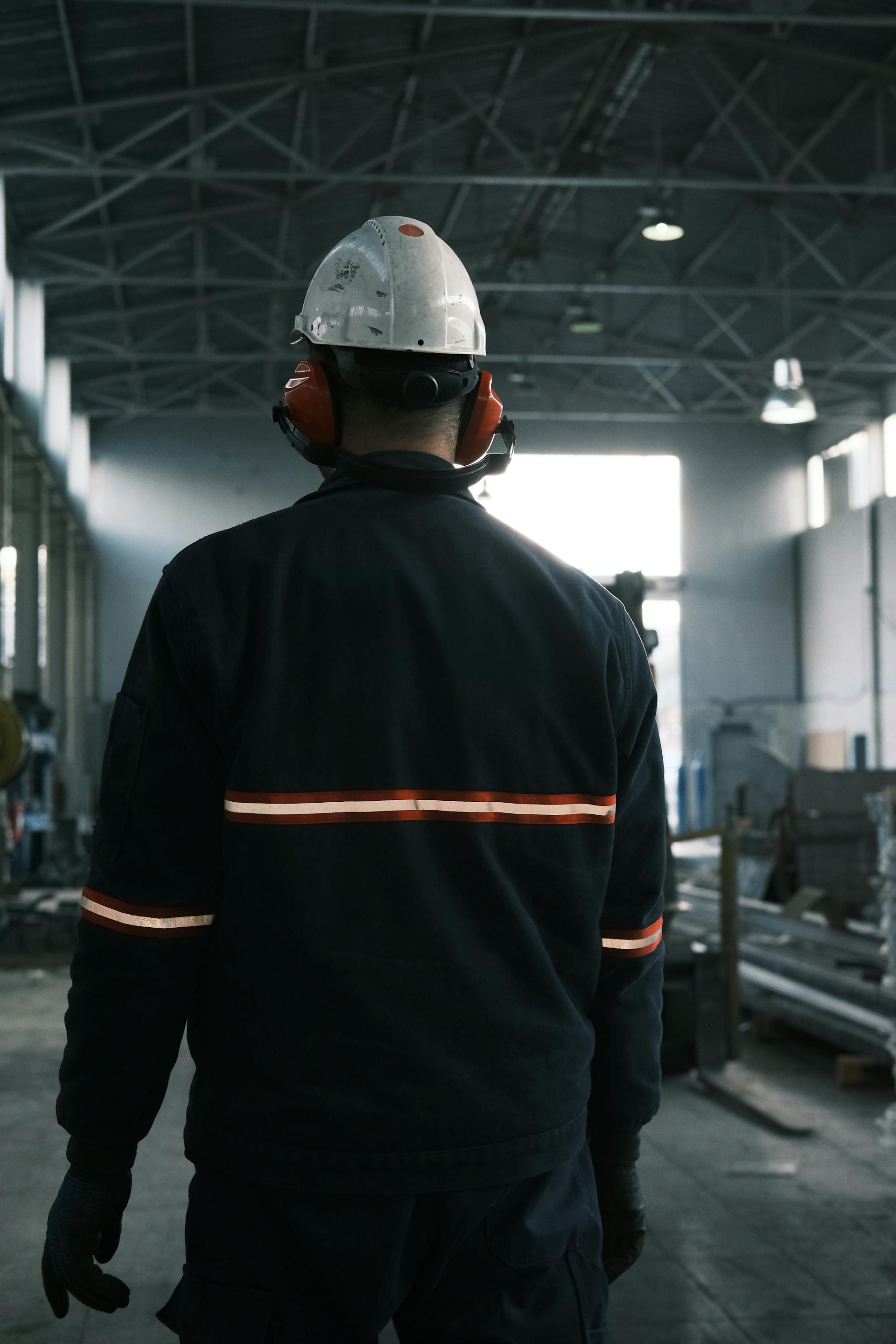 Engine assembly line under CCTV-GPT monitoring — bounding boxes on each operator with live PPE compliance scores